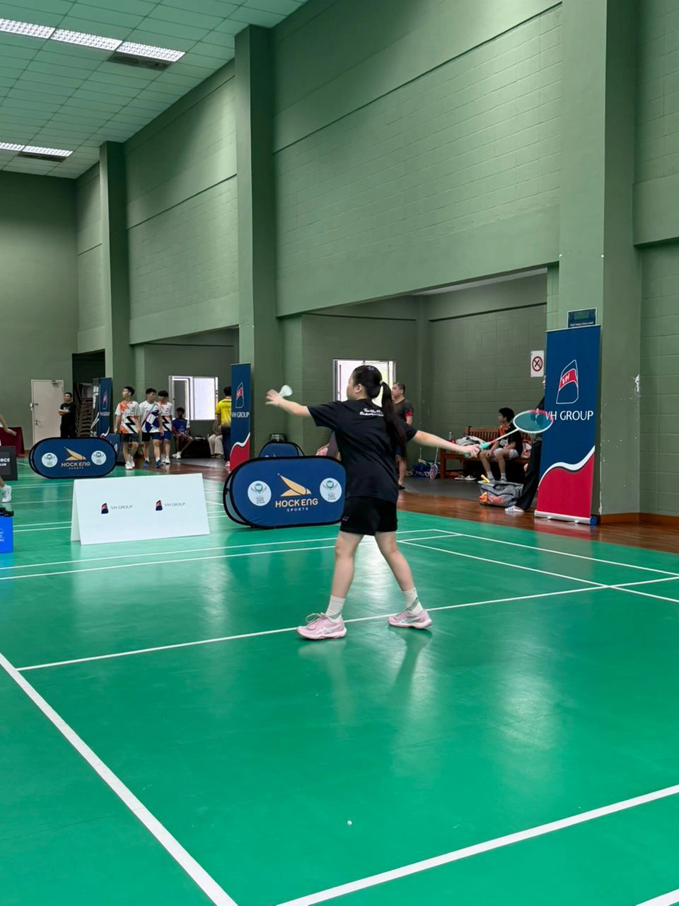 Indoor badminton coaching session at Shuttle Force Badminton Club