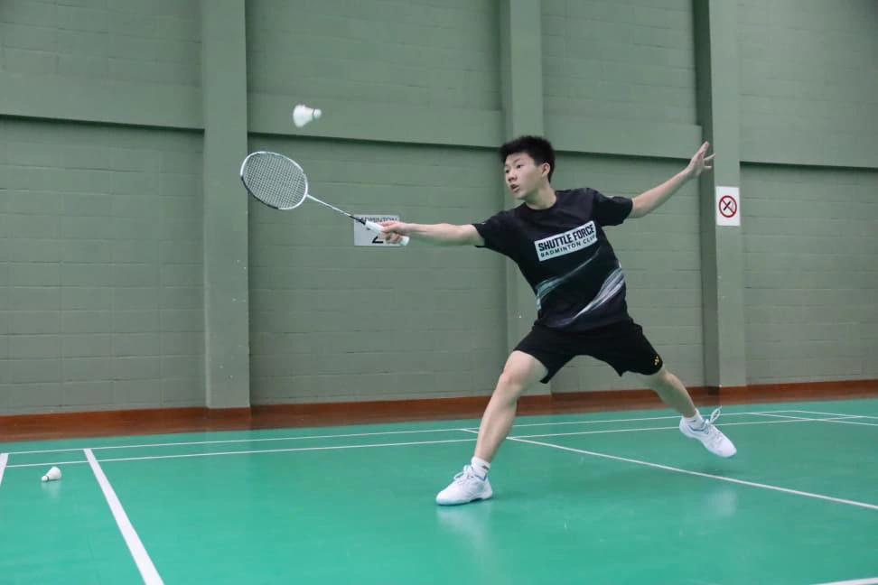 Badminton students practicing footwork during training